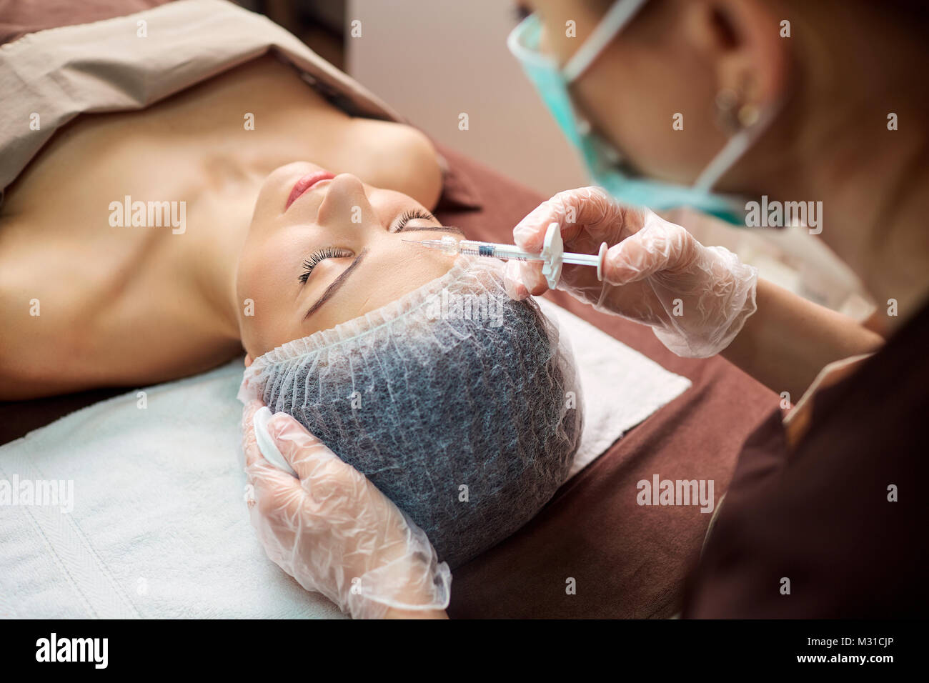 Cosmetic injection in the spa salon.  Stock Photo