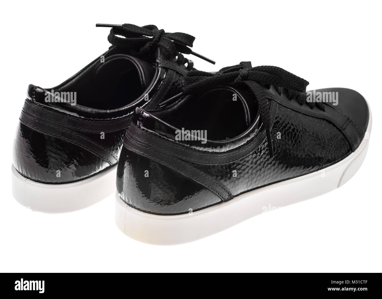 black trainers with white soles