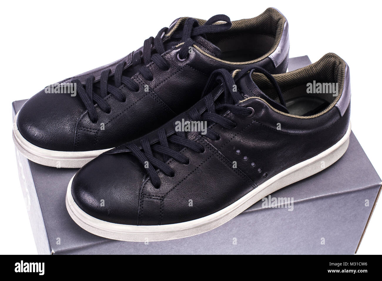 Roasted Uncertain Pedestrian Black sneakers with white soles hi-res stock photography and images - Alamy