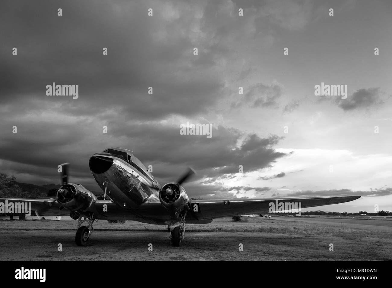 A Douglas DC-3 aircraft taxis from the runway to the hangar after landing at the airport of Villavicencio, Colombia. Stock Photo