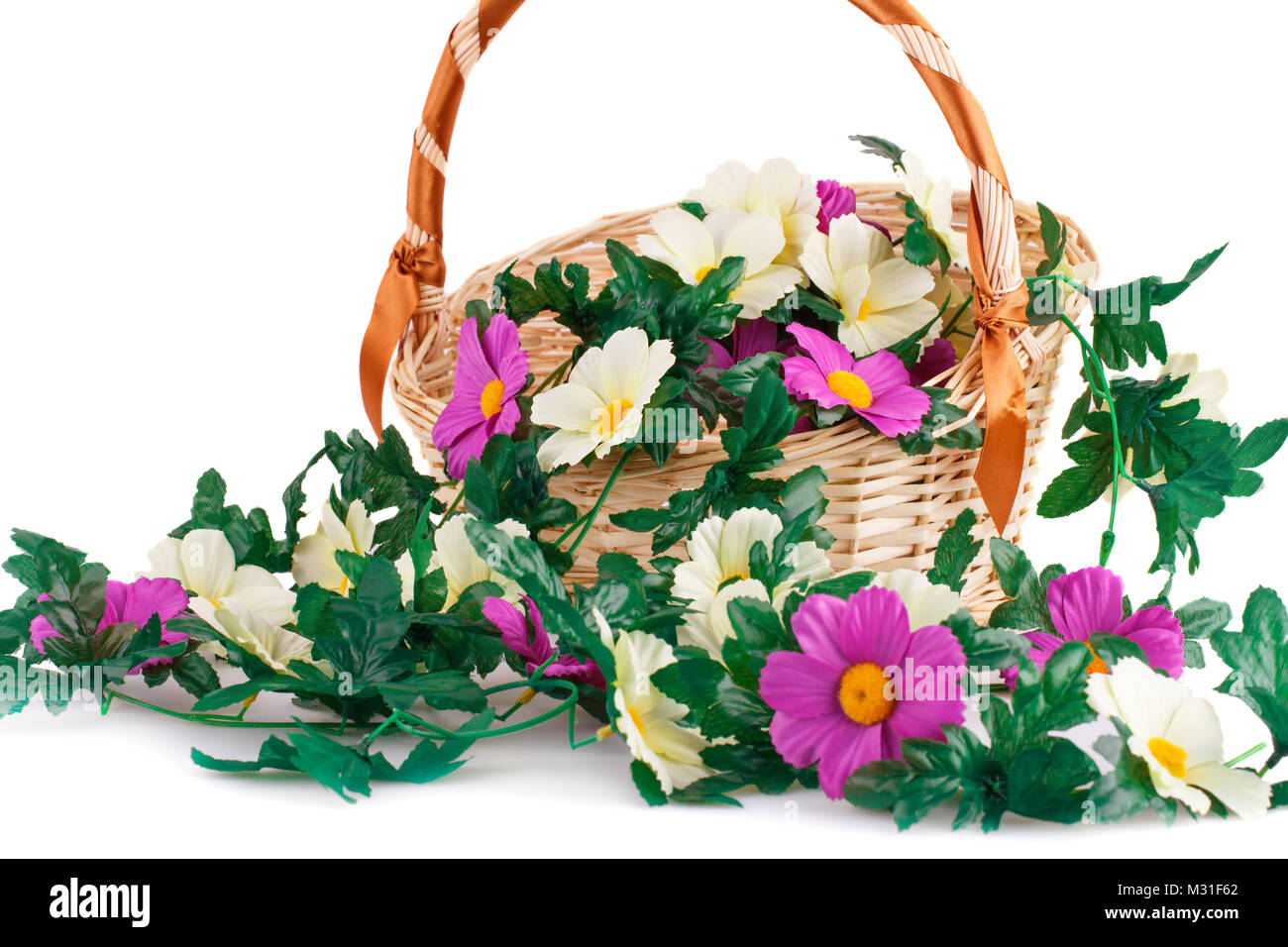 Fabric flowers in wicker basket isolated on white background Stock ...