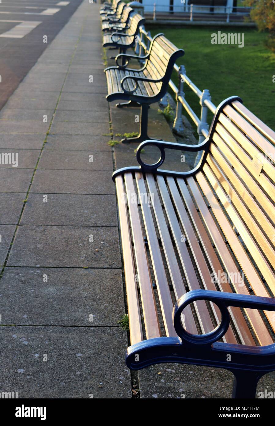 Row of benches on seafront at Portsmouth, UK Stock Photo