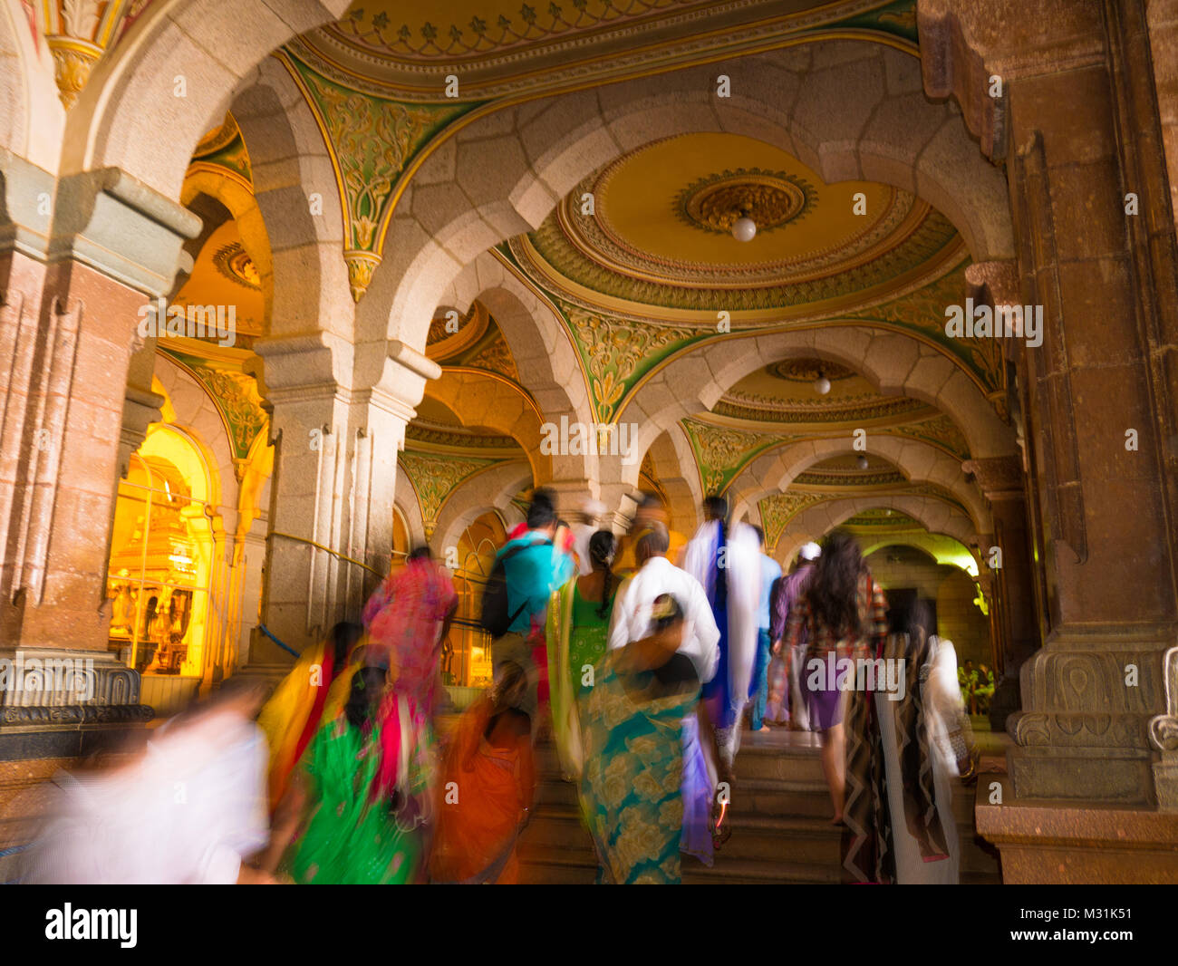MYSORE, INDIA - January 11 2018: People walk in the Colorful ornate interior halls of royal Mysore Palace, Karnataka, India Stock Photo