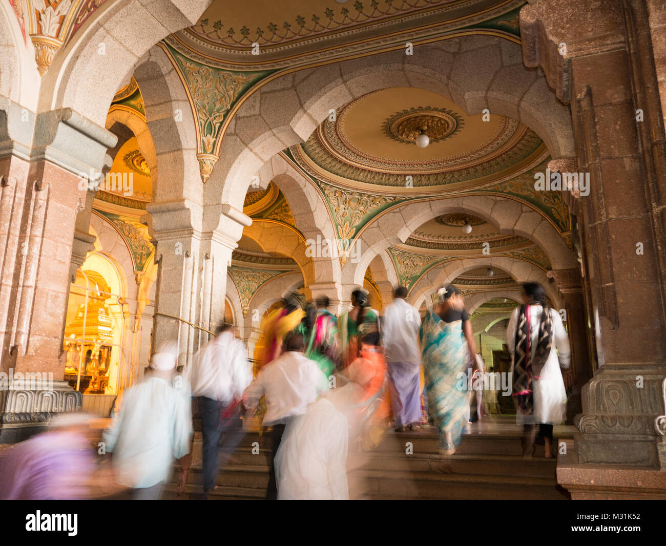 MYSORE, INDIA - January 11 2018: People walk in the Colorful ornate interior halls of royal Mysore Palace, Karnataka, India Stock Photo