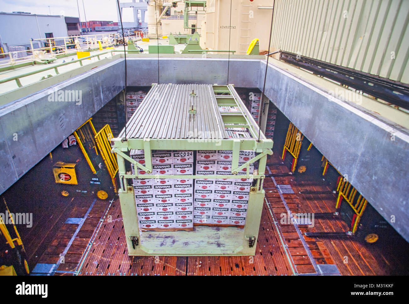 Ship cargo hold loading of fruit, bananas for export import Stock Photo