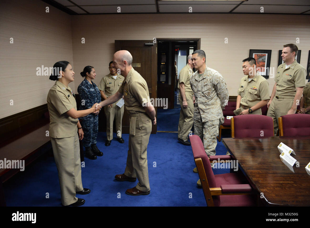 Lt. Cynthia Duke receives the Navy and Marine Corps commendation award medal from Commander, U.S