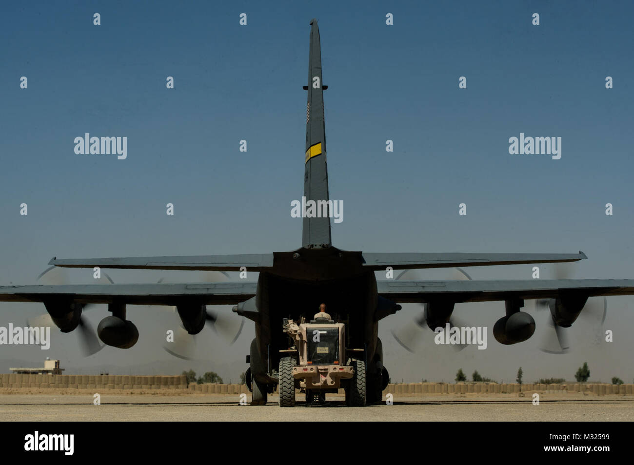 U.S. Air Force Air Mobility Division personnel load retrograde cargo on