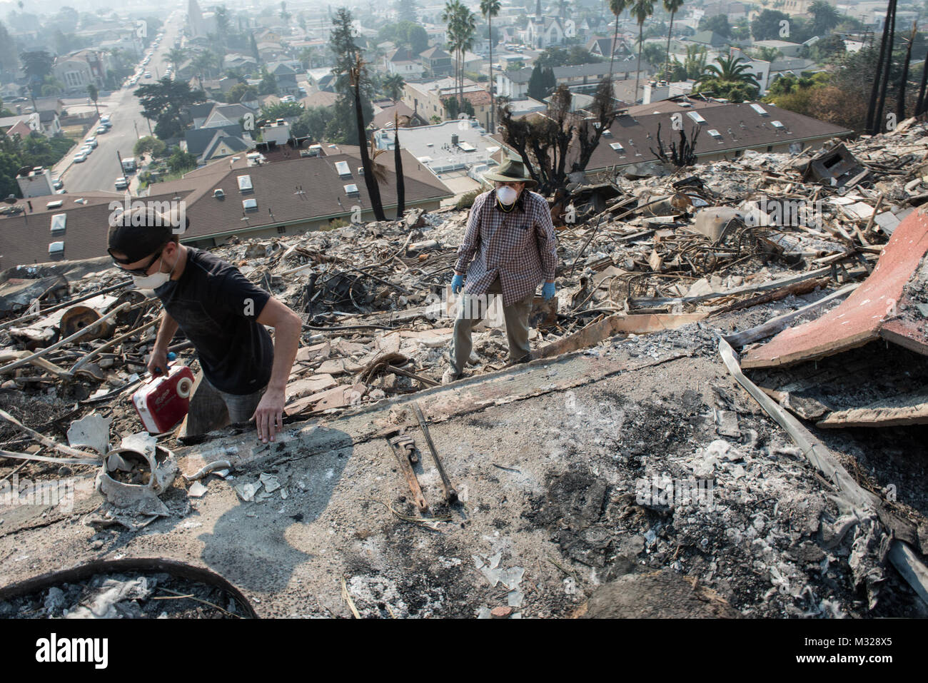 Residents of a 52unit apartment complex search for belongings, Dec. 13