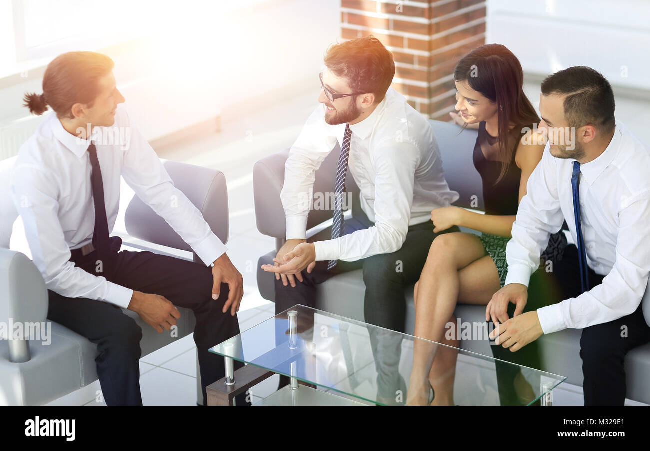employees sitting in the lobby of the office Stock Photo - Alamy