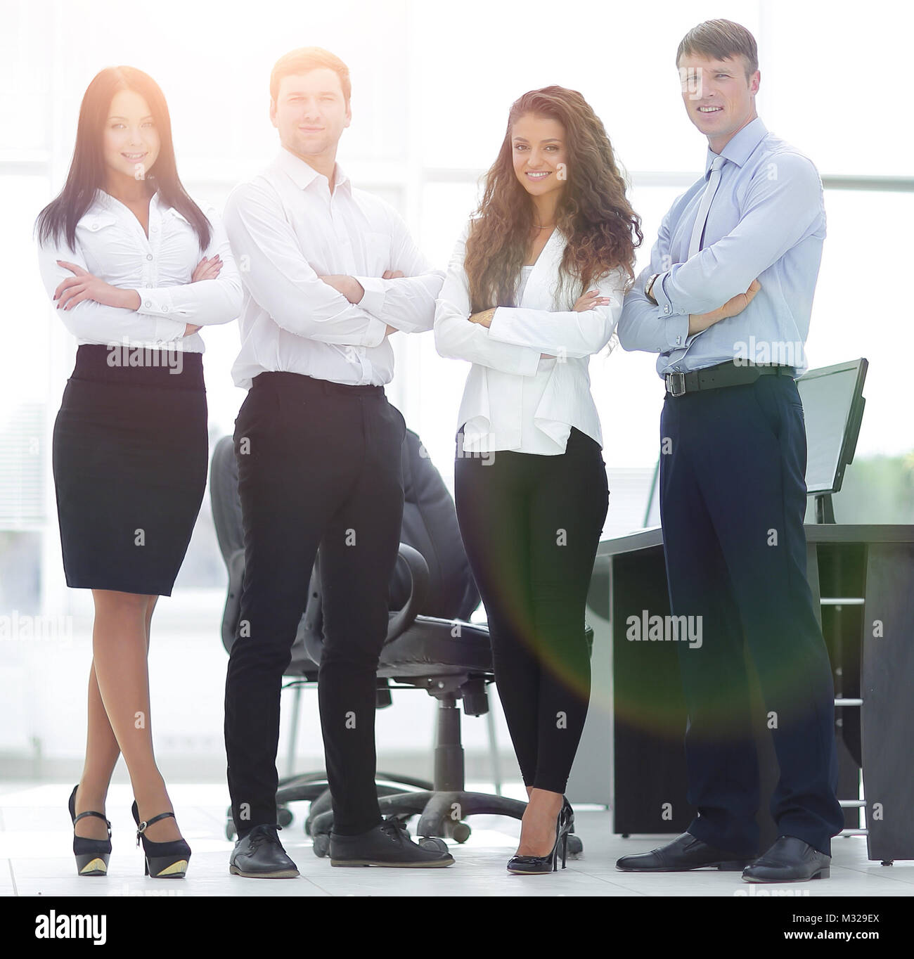 successful business team standing near the desktop Stock Photo - Alamy