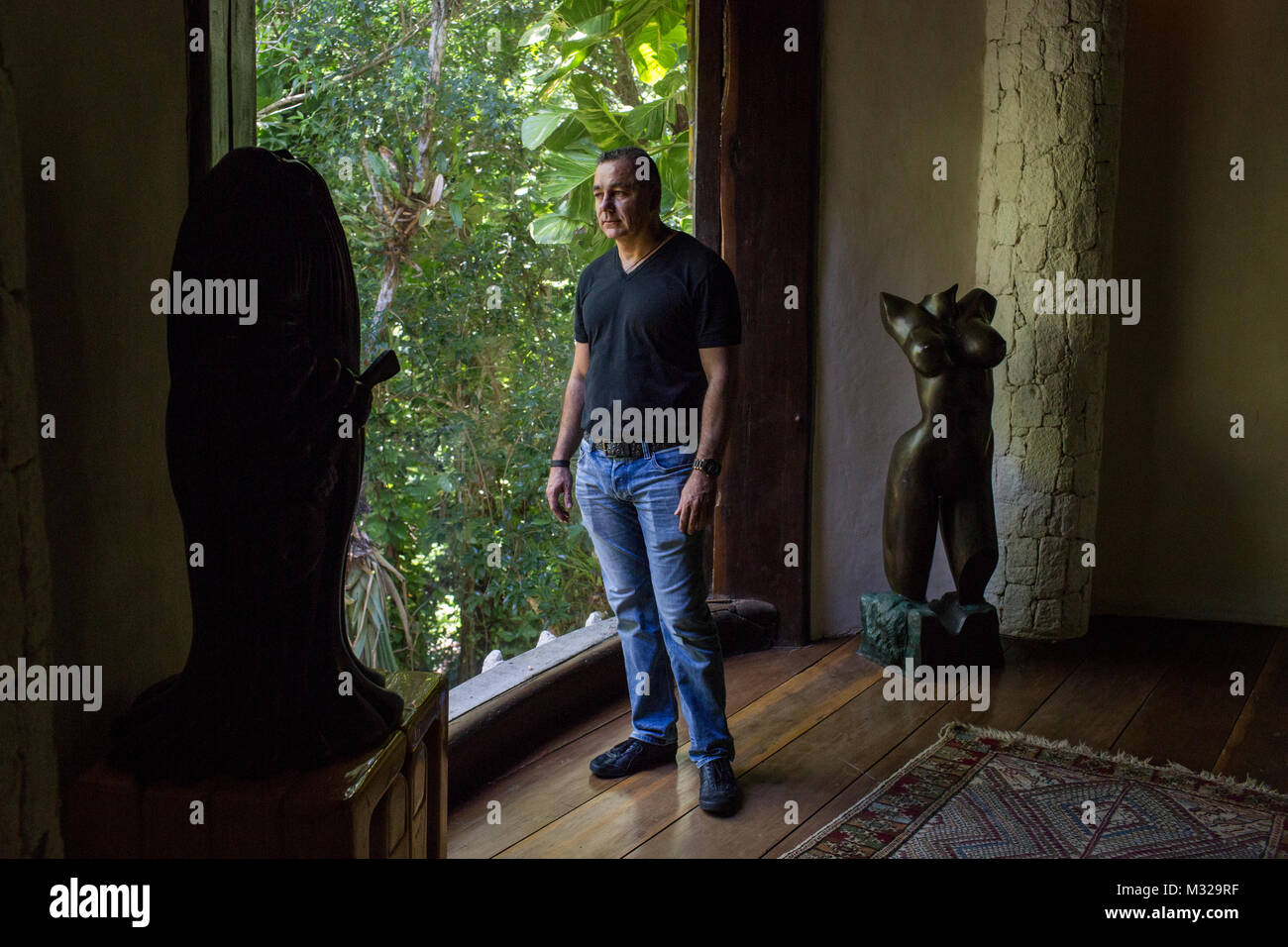 Carlos Mimenza, an entrepreneur, poses for a photo in one of his homes in Playa del Carmen, Mexico, on July 11, 2017. Mimenza represents a group of business owners who employ security forces to protect their businesses from extortion. This house is home to a team of computer experts who monitor people of interest. Stock Photo