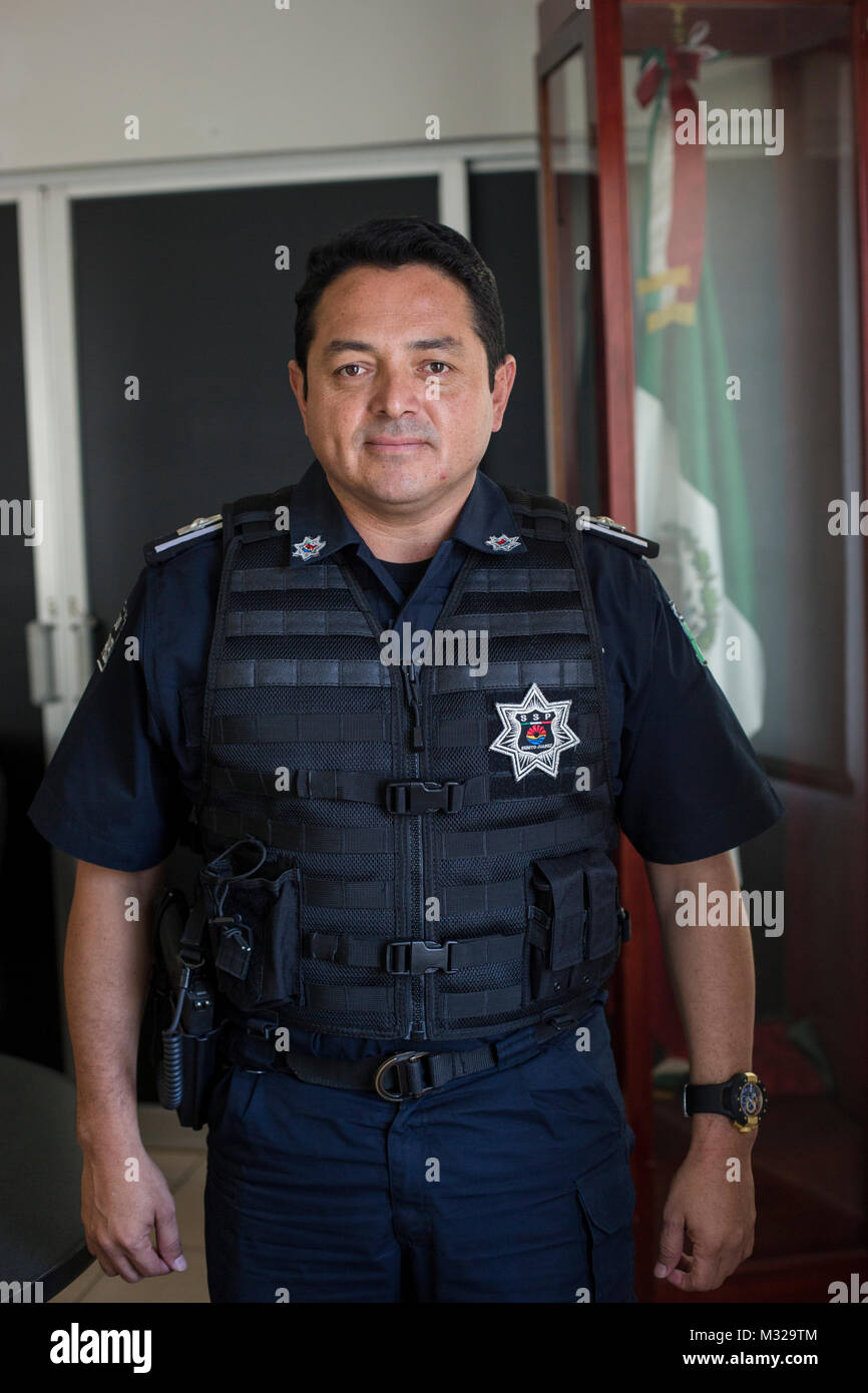 Local police chief Darwin Puc Acosta poses for a photo at police headquarters in downtown Cancun, Mexico, on July 12, 2017. Violence in Mexico spiked in 2017 with more than 12,000 homicides in the first six months, leaving many to question the future of this popular touristic area. Stock Photo