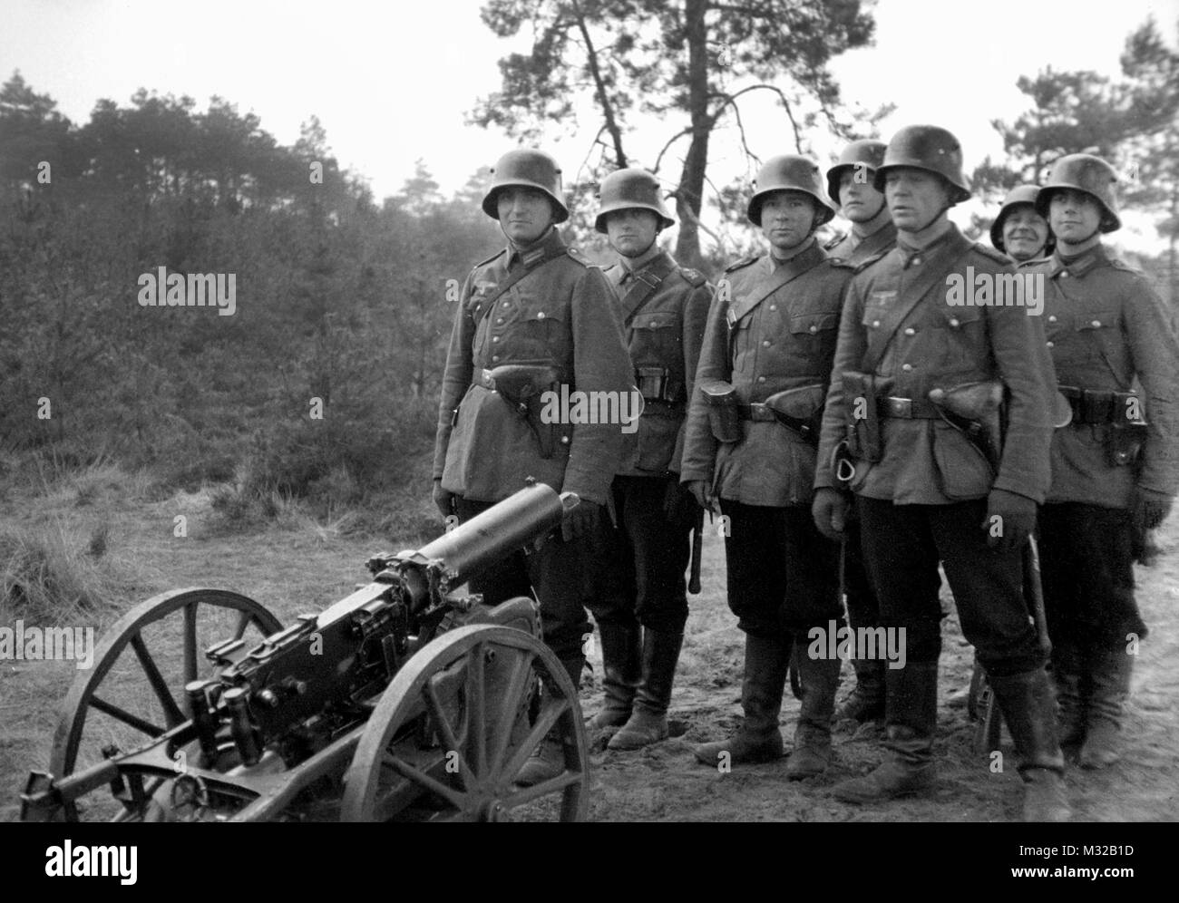 German infantry training unit stands by their gun, ca. 1938. Stock Photo