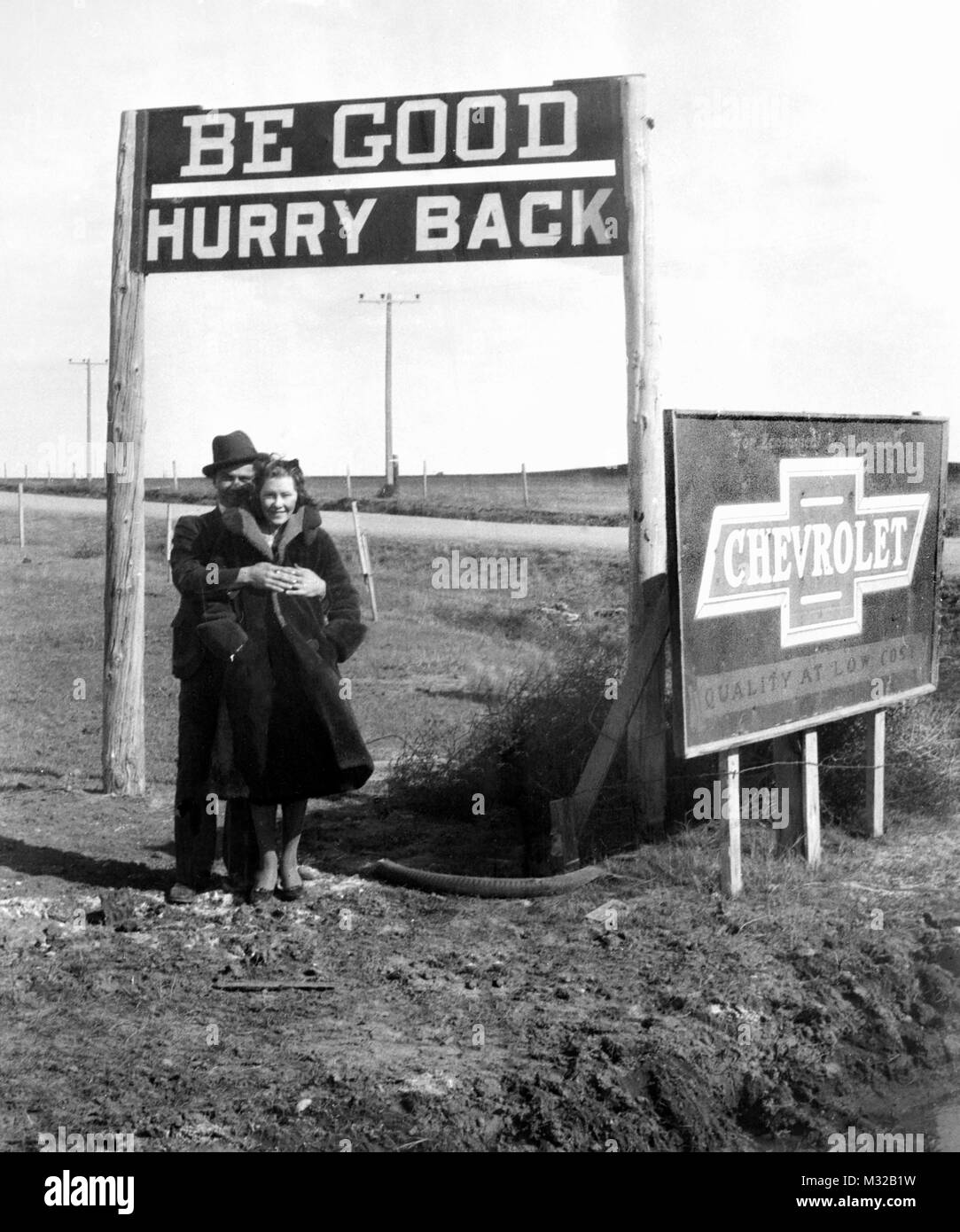 Young couple in love on the road, ca. 1935. Stock Photo