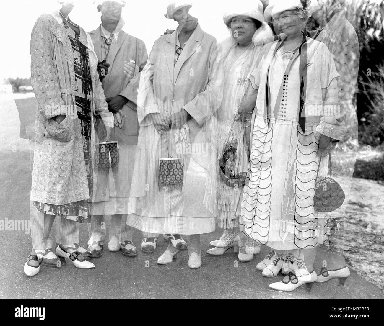 Double exposure of fashionable group, ca. 1925. Stock Photo