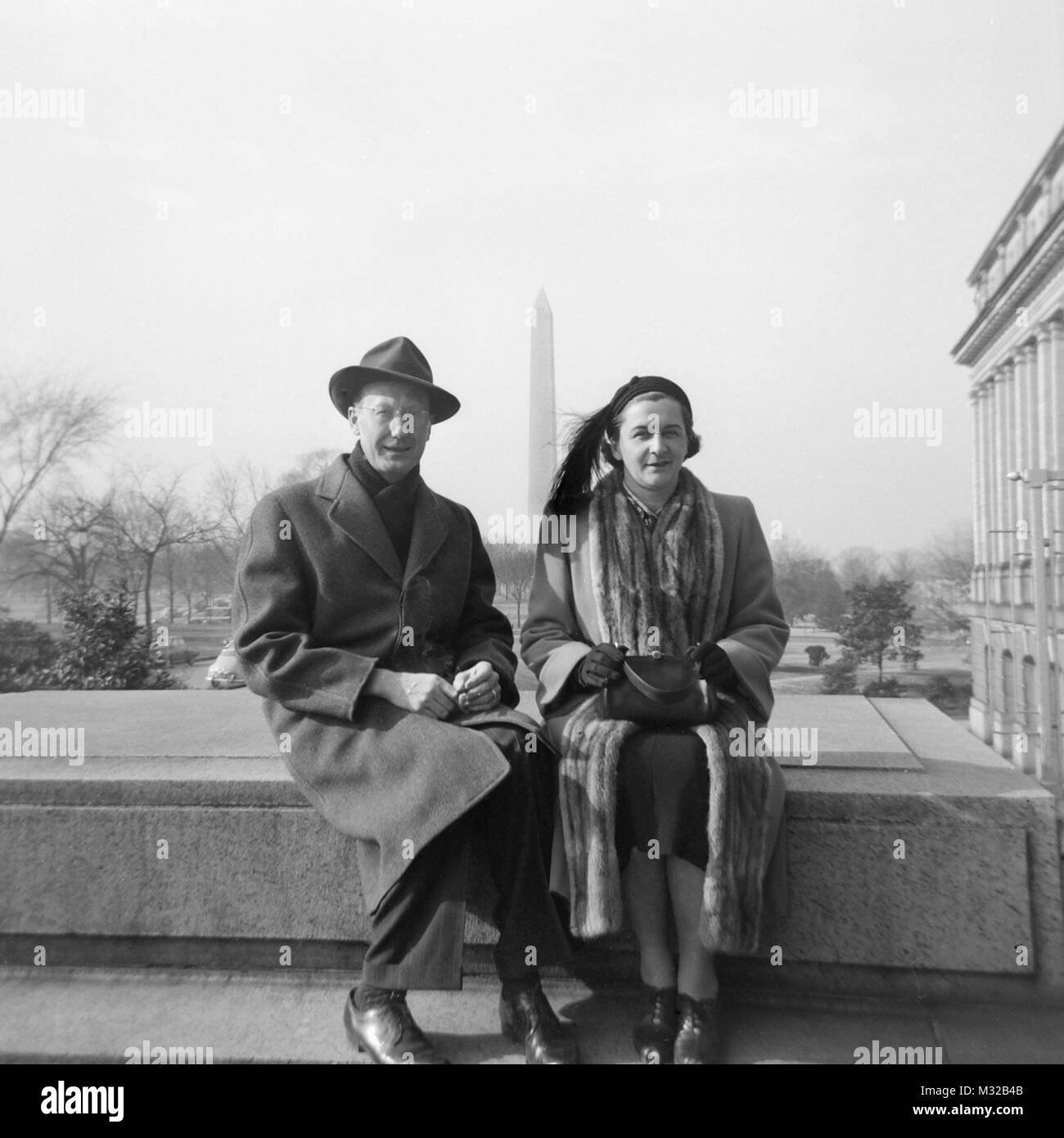 Mature couple takes a break while touring Washington DC, ca. 1949. Stock Photo