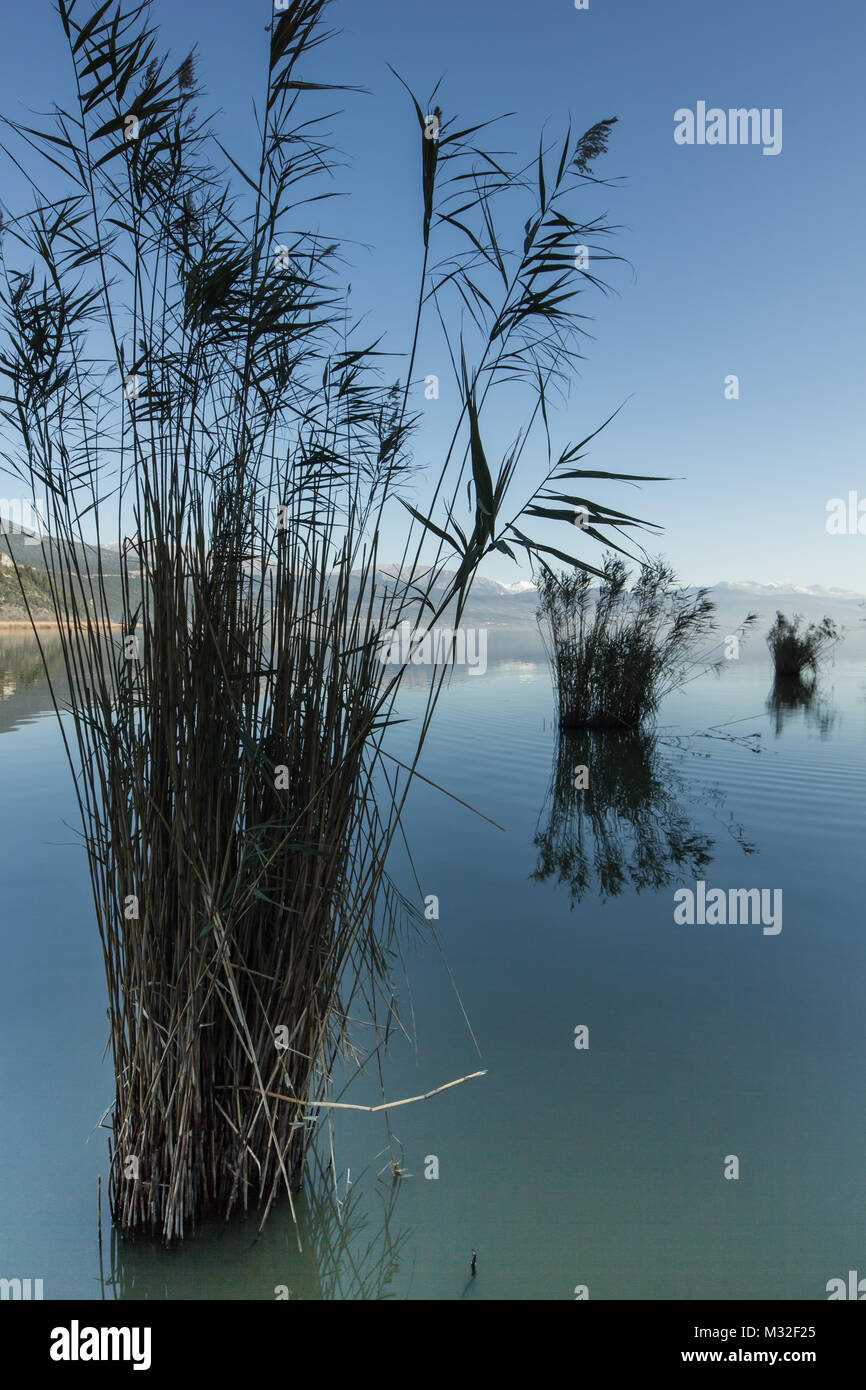 Ioannina lake in Epirus Region, Greece. Artistic panoramic view with natural reflection in the water and fog Stock Photo