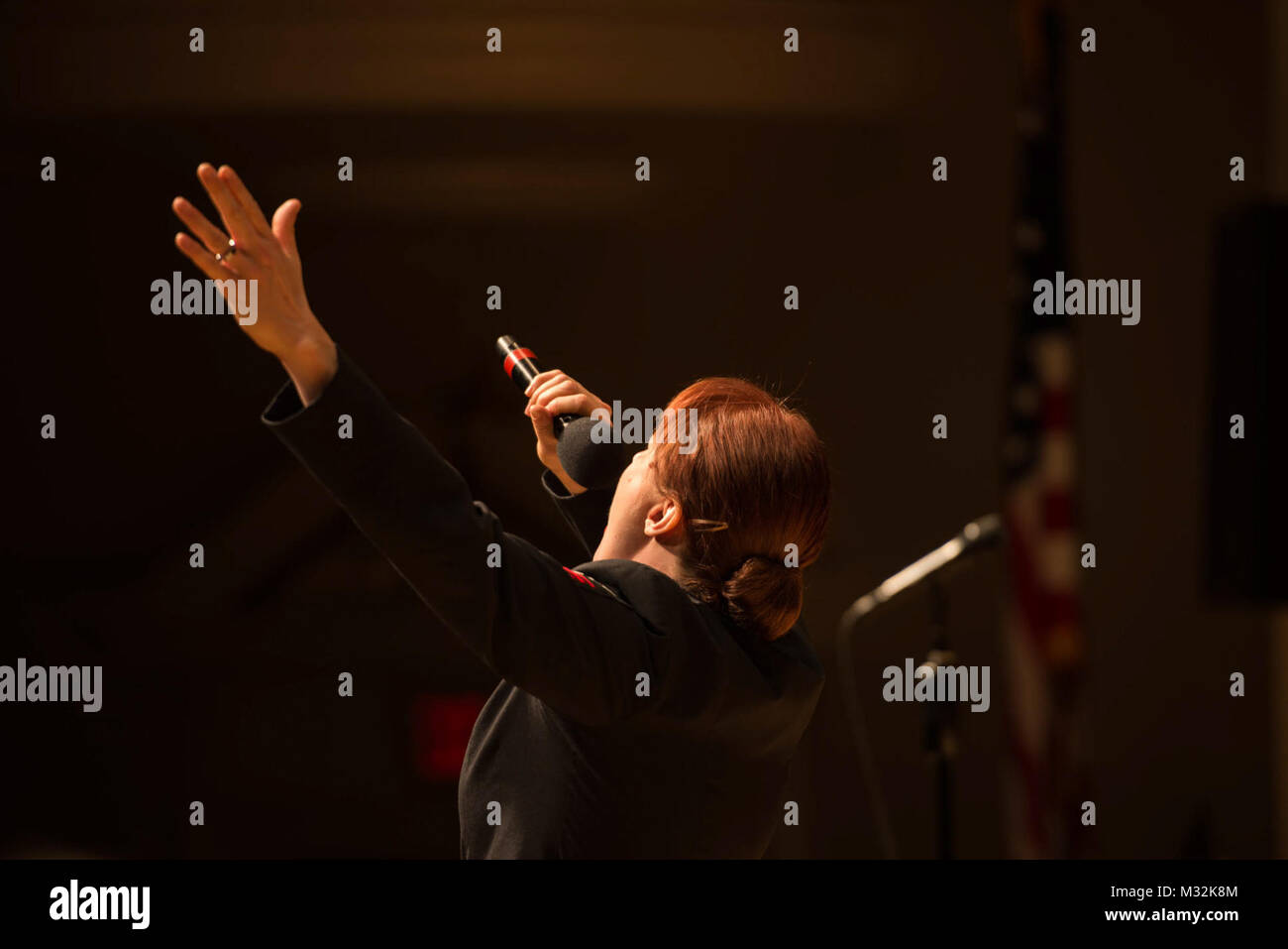 EDINBORO, PA (April 5, 2016) Musician 1st Class Maia Rodriguez sings with the United States Navy Band Sea Chanters chorus during a concert at Edinboro University. The Sea Chanters are on a 22-day tour of the northeastern United States. (U.S. Navy photo by Chief Musician Melissa Bishop/Released) 160405-N-NW255-069 by United States Navy Band Stock Photo