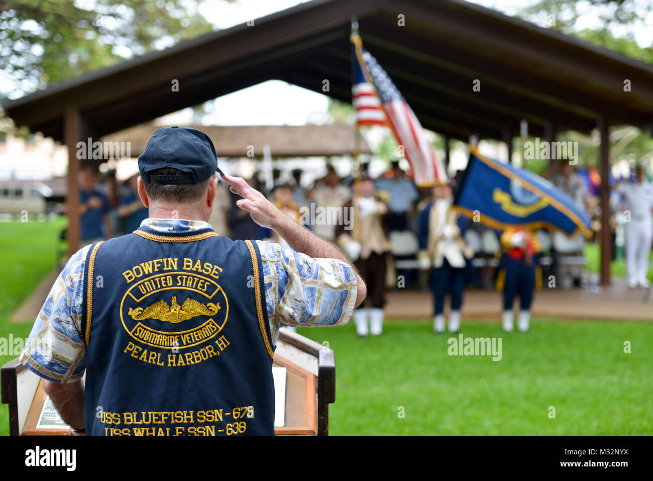 160530-N-LY160-735  JOINT BASE PEARL HARBOR-HICKAM, Hawaii (May 30, 2016) – Retired Lt. Cmdr. Paul T. Jurcsak, base commander of the U.S. Submarine Veterans Bowfin Base, salutes the national ensign during the Memorial Day ceremony at the USS Parche Submarine Park and Memorial at Joint Base Pearl Harbor-Hickam. The service honored past submariners and paid tribute to the 65 U.S. submarines lost since 1915, with 52 lost during World War II alone.  (U.S. Navy photo by Mass Communication Specialist 2nd Class Michael H. Lee) 160530-N-LY160-735 1 27329301432 o Stock Photo
