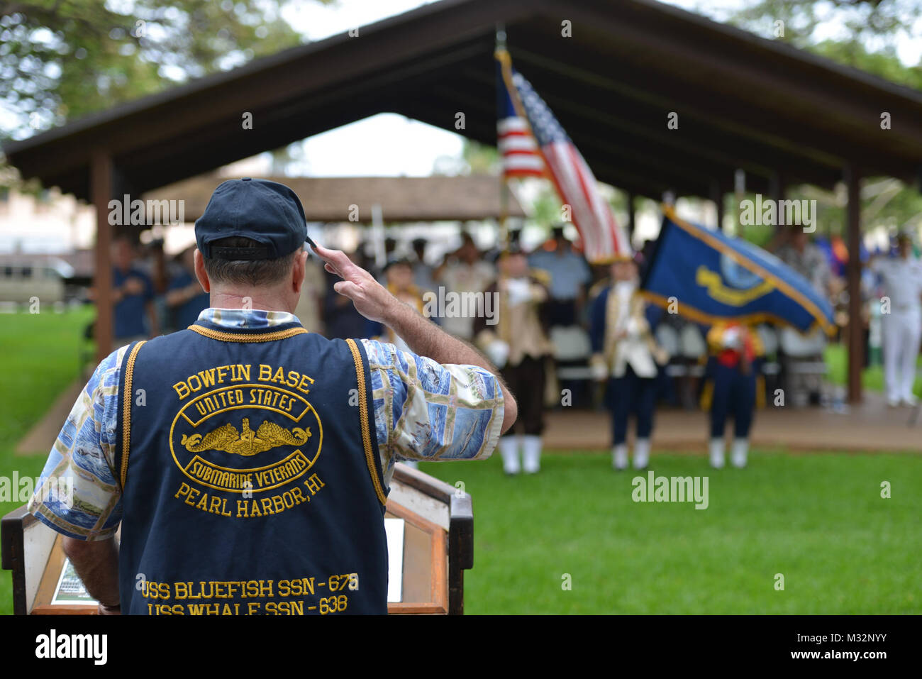 160530-N-LY160-735  JOINT BASE PEARL HARBOR-HICKAM, Hawaii (May 30, 2016) – Retired Lt. Cmdr. Paul T. Jurcsak, base commander of the U.S. Submarine Veterans Bowfin Base, salutes the national ensign during the Memorial Day ceremony at the USS Parche Submarine Park and Memorial at Joint Base Pearl Harbor-Hickam. The service honored past submariners and paid tribute to the 65 U.S. submarines lost since 1915, with 52 lost during World War II alone.  (U.S. Navy photo by Mass Communication Specialist 2nd Class Michael H. Lee) 160530-N-LY160-735 27428259625 o Stock Photo