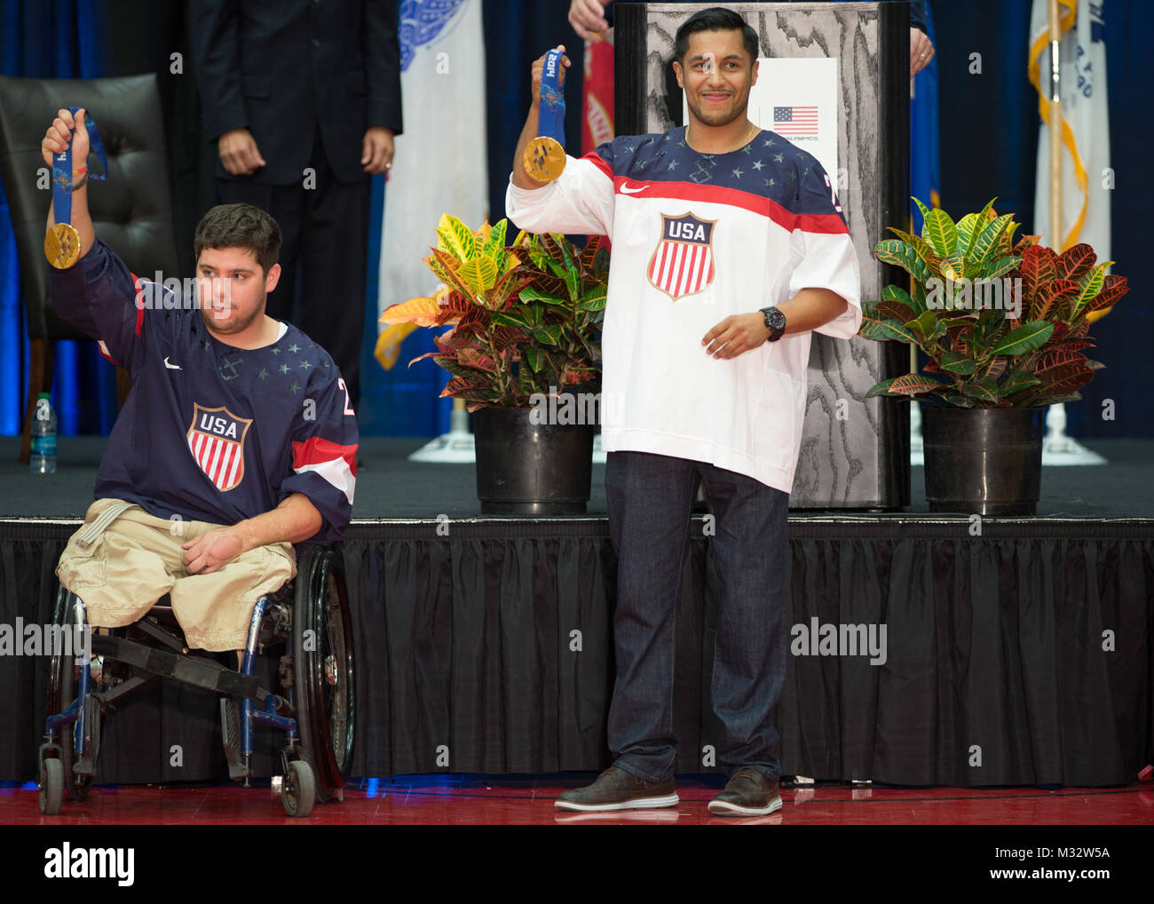 Retired Marine Cpl. Paul Schaus (left) and retired Army Staff Sgt. Rico Roman (right) hold up their gold medals during the opening ceremony of the 2014 Warrior Games, U.S. Olympic Training Center, Colorado Springs, Colorado, Sept 28, 2014. Founded in 2010, the Games are designed to introduce wounded, ill and injured service members and veterans to adaptive sports and encourage them to stay physically active. (U.S. Air Force photo by Senior Airman Justyn M. Freeman/ Released) 140928-F-RN544-076.jpg by Air Force Wounded Warrior Stock Photo
