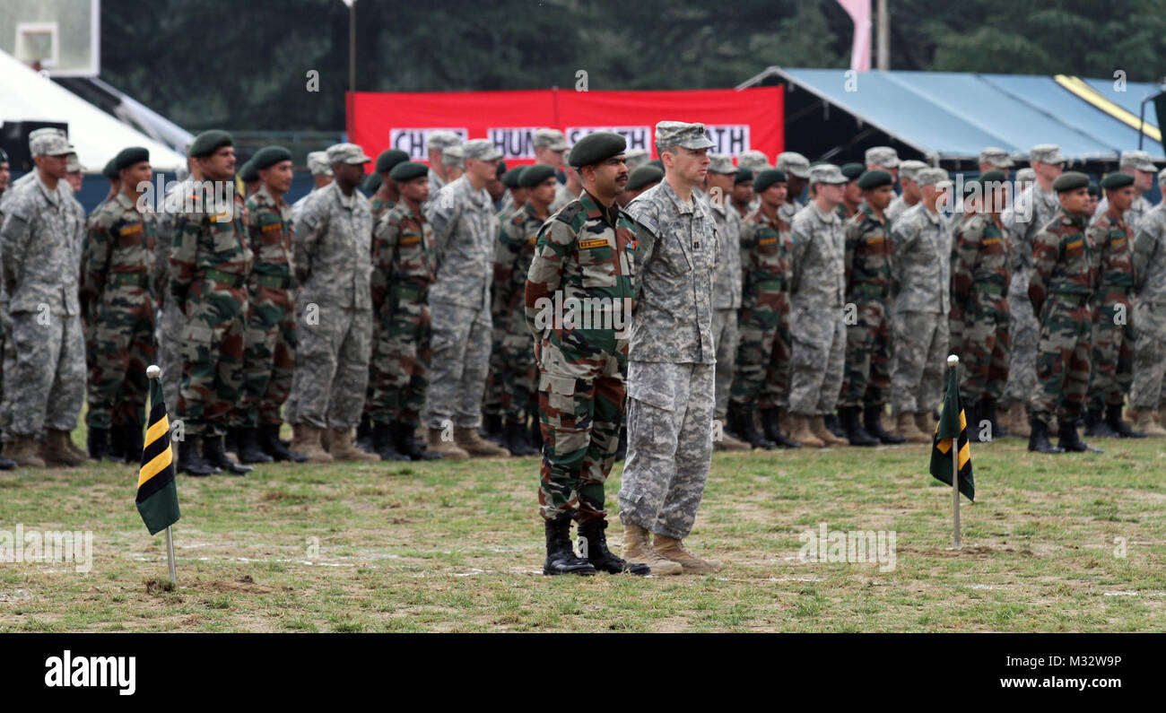 U.S. Capt. Jed Graydon (Front right), commander of C Troop 5th Squadron, 1st Cavalry Regiment, and his Indian Army counterpart lead a formation of U.S. and Indian Army Soldiers during the closing ceremonies for exercise Yudh Abhyas 14 at Chaubattia, India Sept. 30, 2014. More than 100 U.S. Soldiers participated in the exercise, which began Sept. 17 and too place at Ranikhet Cantonment, Utterakhand, India. Yudh Abhyas is an U.S. Army Pacific Command sponsored exercise and is geared toward enhancing cooperation and coordination through training and cultural exchanges and building skills and rela Stock Photo