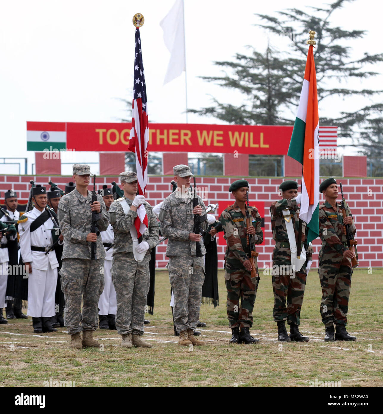 Soldiers from 1st Stryker Brigade Combat Team, 25th Infantry Division and the 2nd Battalion, 9th Ghurak Regiment of the Indian Army present their national colors during the closing ceremonies for exercise Yudh Abhyas 14 at Chaubattia, India Sept. 30, 2014. More than 100 U.S. Soldiers participated in the exercise, which began Sept. 17 and too place at Ranikhet Cantonment, Utterakhand, India. Yudh Abhyas is an U.S. Army Pacific Command sponsored exercise and is geared toward enhancing cooperation and coordination through training and cultural exchanges and building skills and relationships neces Stock Photo