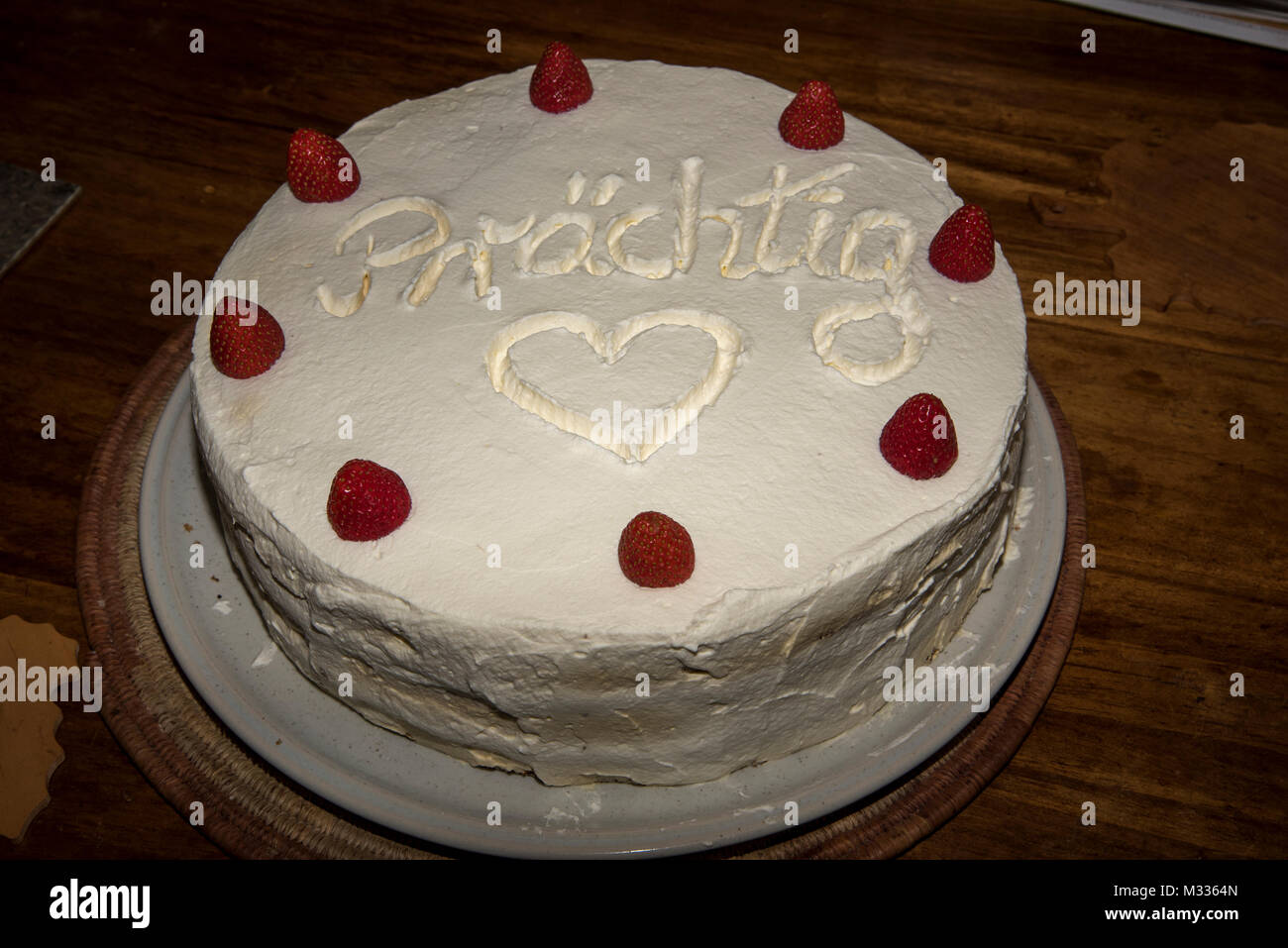 A home made cake is served with decorative ornamentic elements.  Eine selbstgebackene Torte  mit einer netten Verzierung. Stock Photo