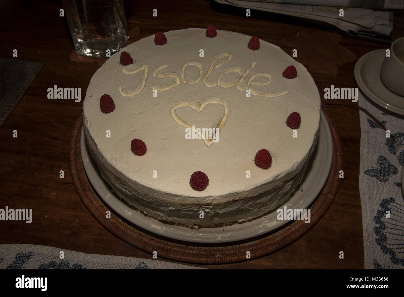 A home made cake is served with decorative ornamentic elements.  Eine selbstgebackene Torte  mit einer netten Verzierung. Stock Photo