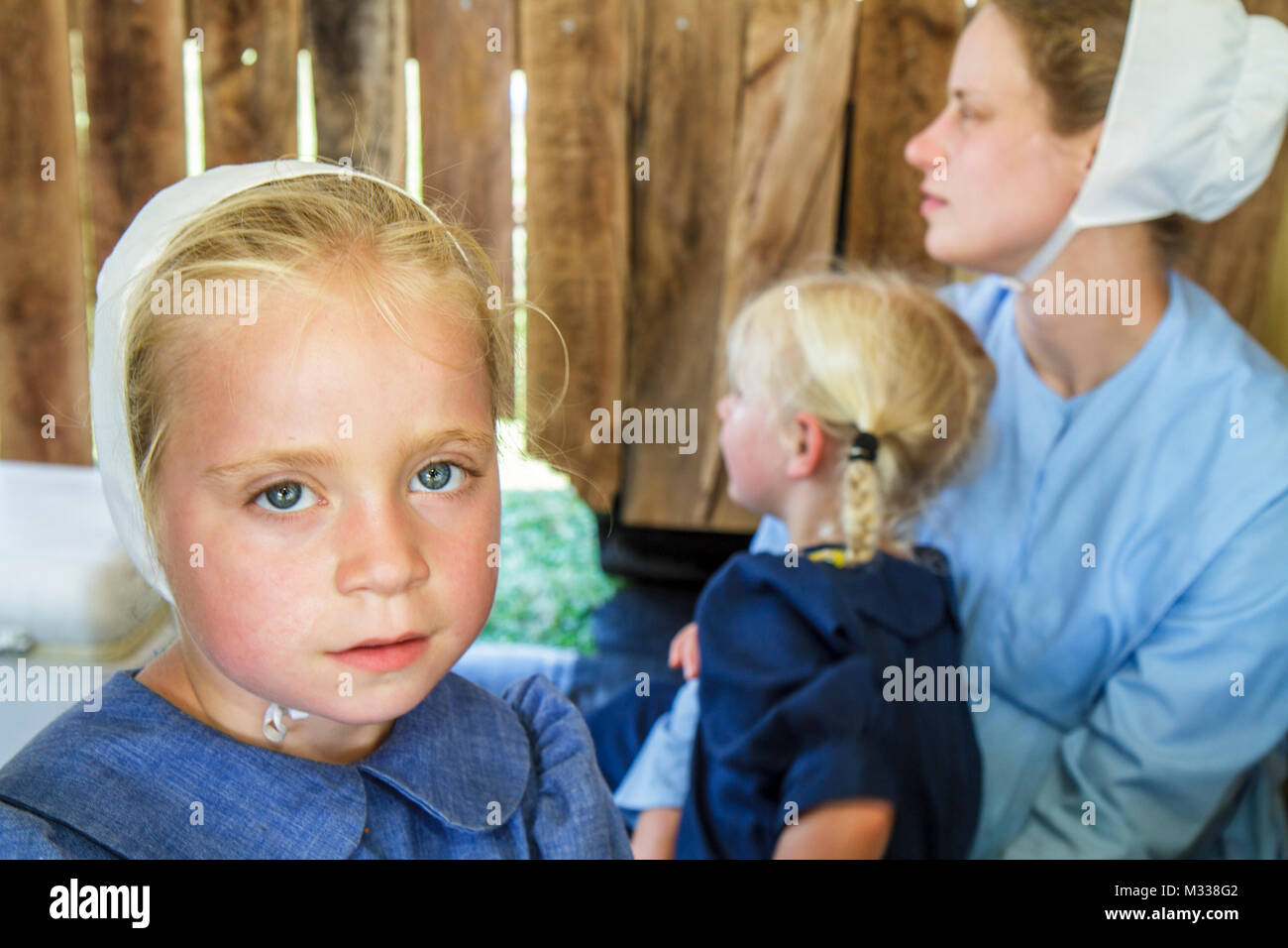 Pennsylvania Kutztown,Kutztown Folk Festival,Pennsylvania Dutch Amish girl kids children mother parent daughter,bonnet traditional dress clothing fami Stock Photo