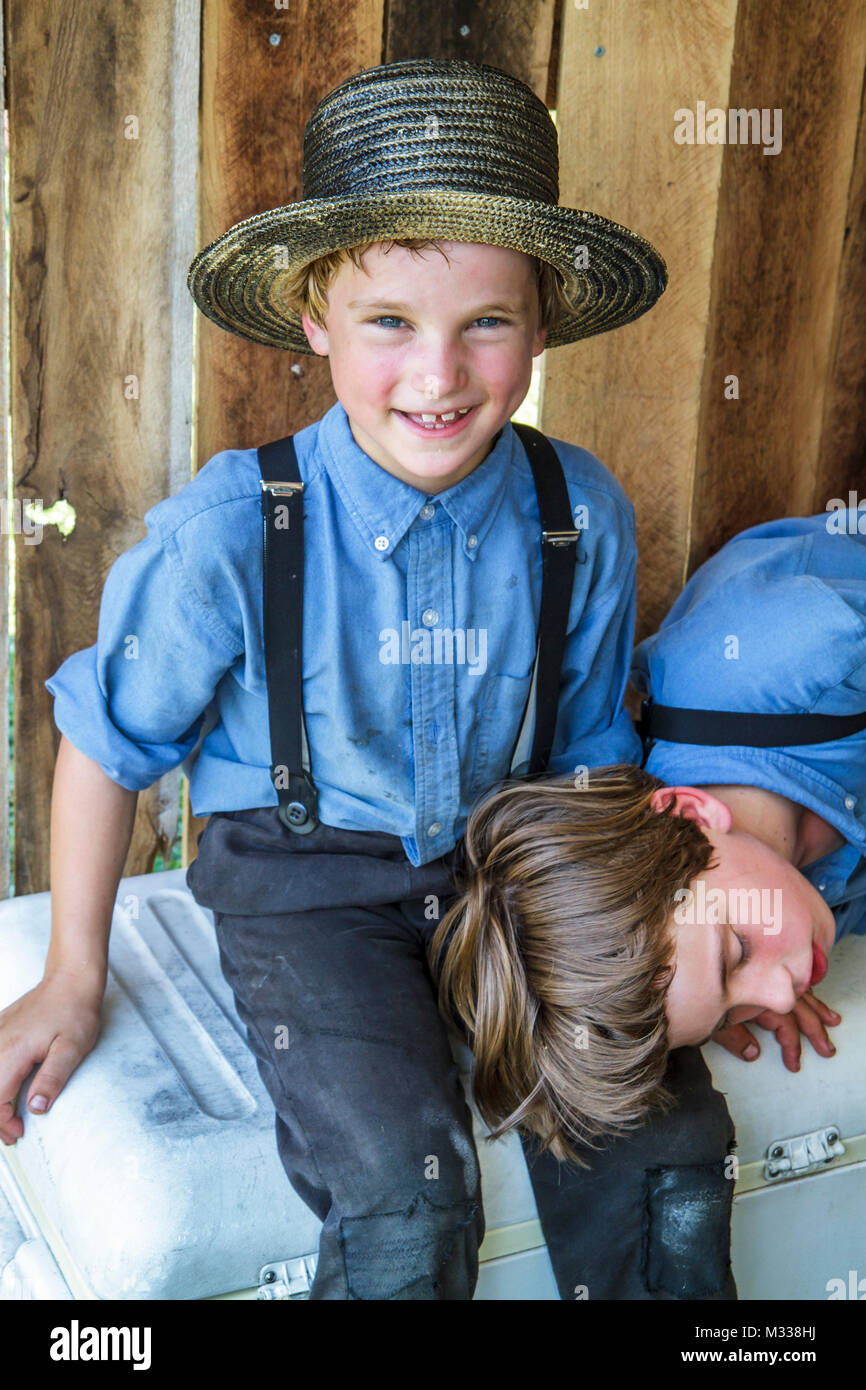 Pennsylvania Kutztown,Kutztown Folk Festival,Pennsylvania Dutch Amish boys kids children,brothers straw hat suspenders plain dress siblings, Stock Photo