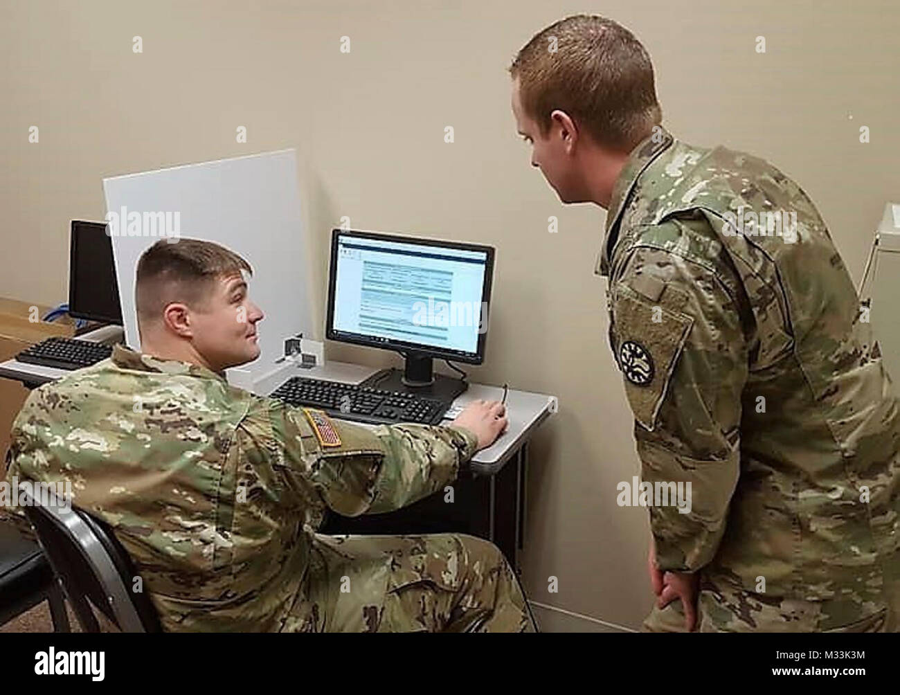Idaho Army National Guard Soldier, Sgt. Charles Wical (right) helps Sgt