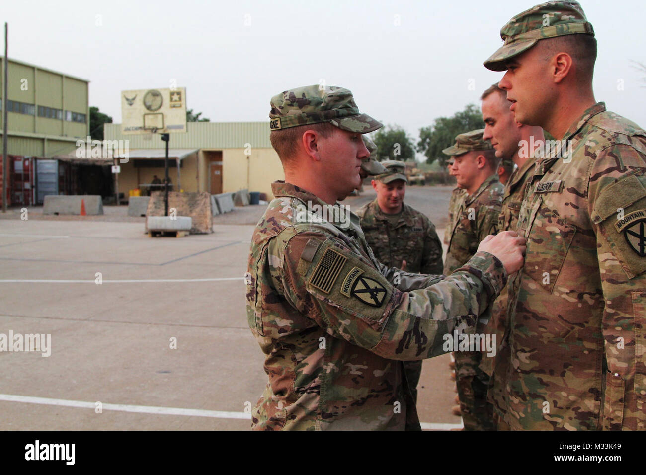 Soldiers of Task Force Darby and 1st Battalion, 87 Infantry Regiment, 1st Brigade Combat Team, 10th Mountain Division, are promoted from PFC to SPC and SPC to CPL in Garoua. TF Darby serve members are serving in a support role for the Cameroonian Military’s fight against the violent extremist organization Boko Haram. ( Stock Photo