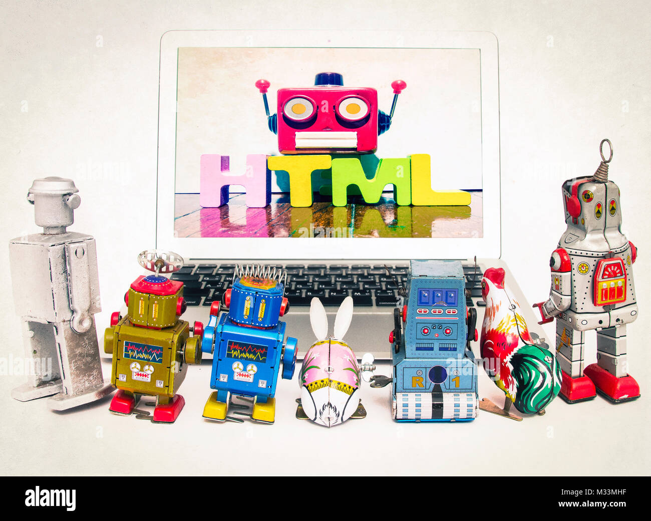 kid robots learn HTML from ronot teacher on a laptop Stock Photo - Alamy