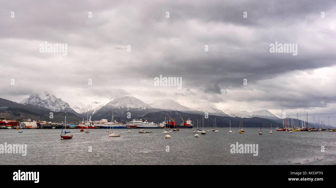 Harbor at Ushuaia, Argentina surrounded by the Andes Mountains Stock Photo