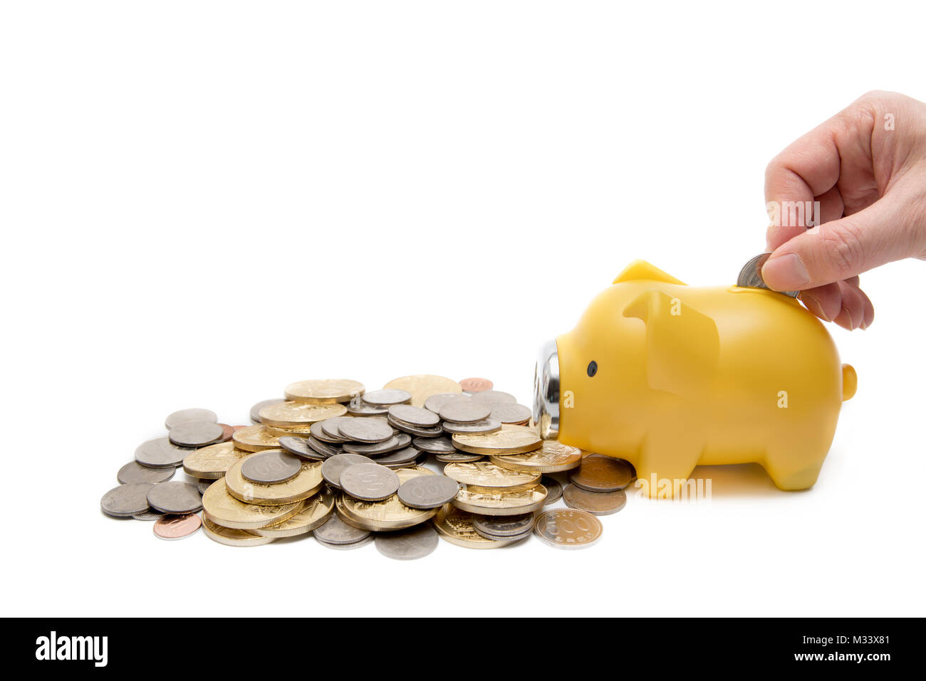 Coins and Piggy banks, Economic Concepts. Isolated. Stock Photo