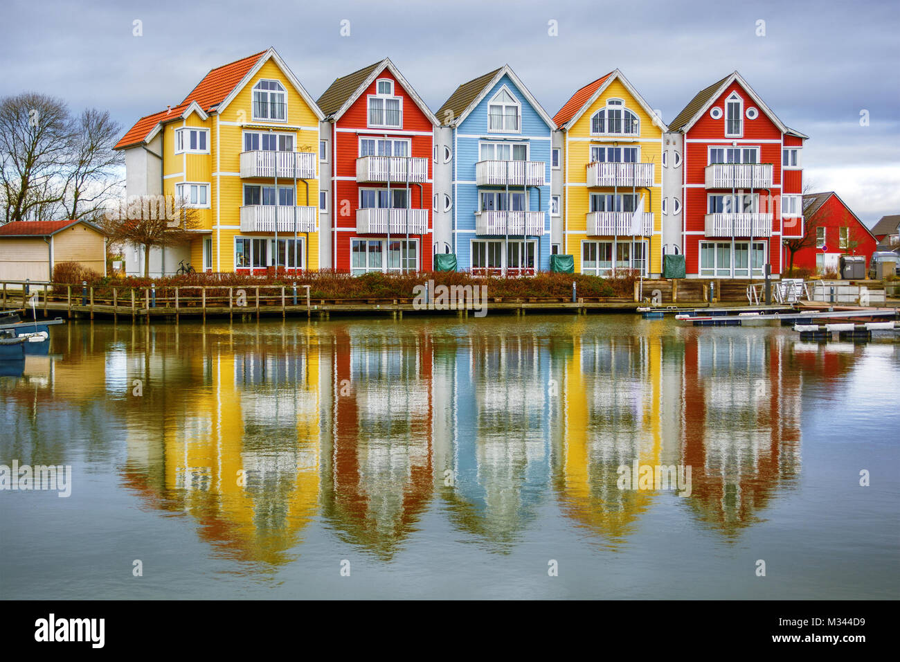 Multi-colored houses along the waterfront, Greifswald, Vorpommern-Greifswald, Mecklenburg-Vorpommern, Germany Stock Photo