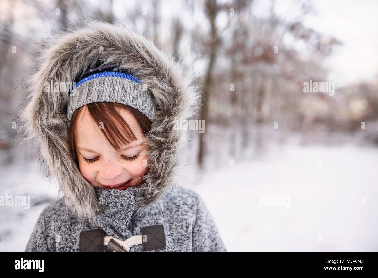 Portrait of a smiling girl standing in a rural winter landscape Stock ...