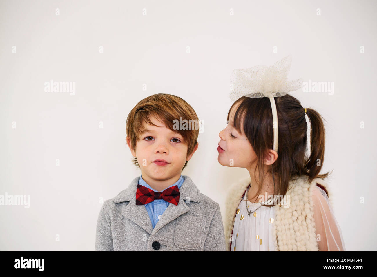 Portrait of a girl looking at a boy Stock Photo - Alamy