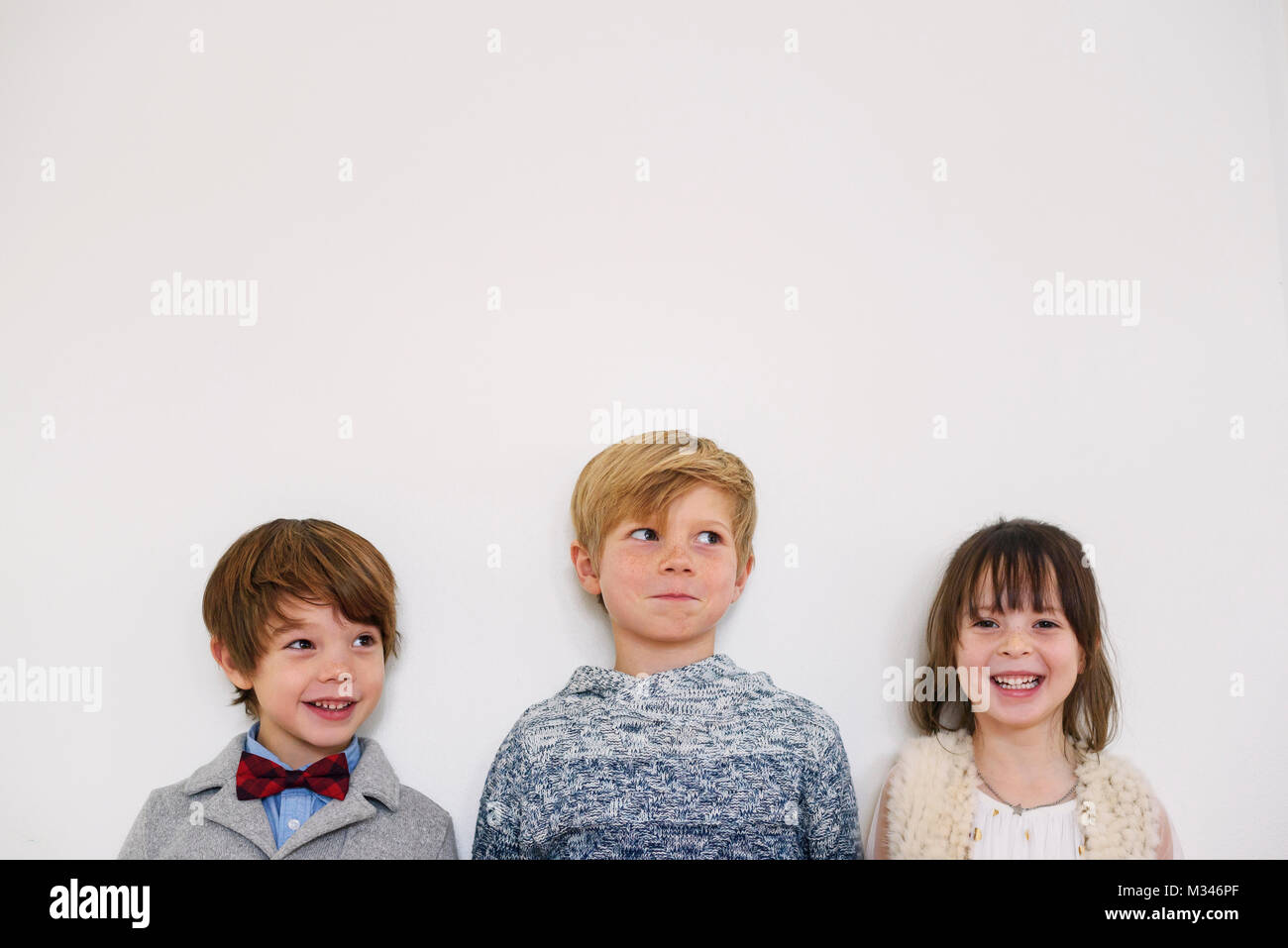 Portrait of three smiling children Stock Photo