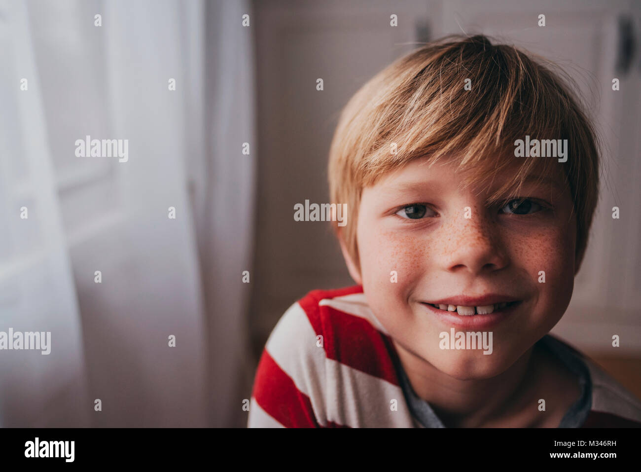 Portrait of a smiling boy with freckles Stock Photo