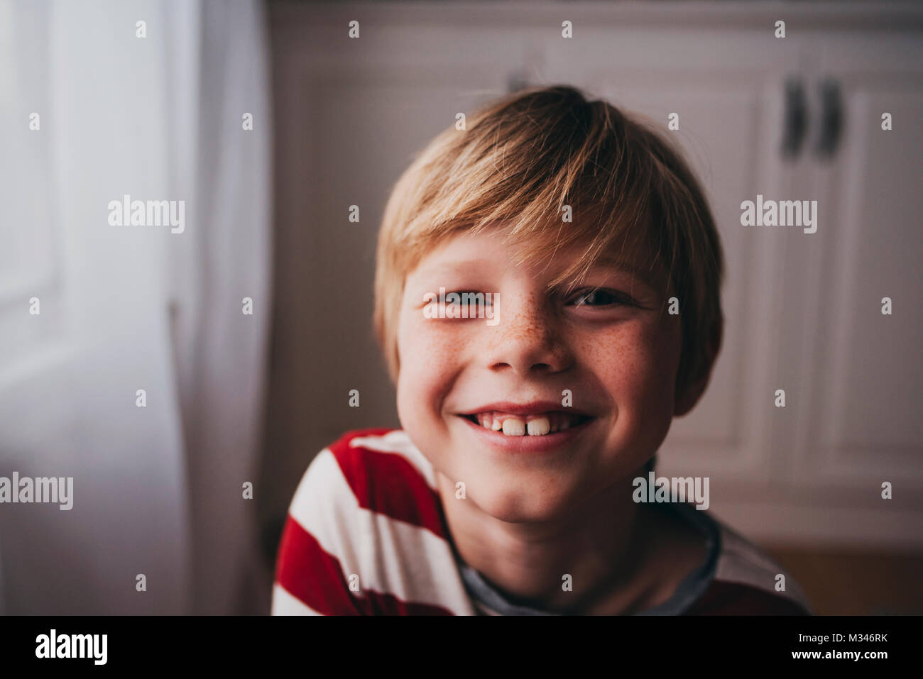 Portrait of a smiling boy with freckles Stock Photo