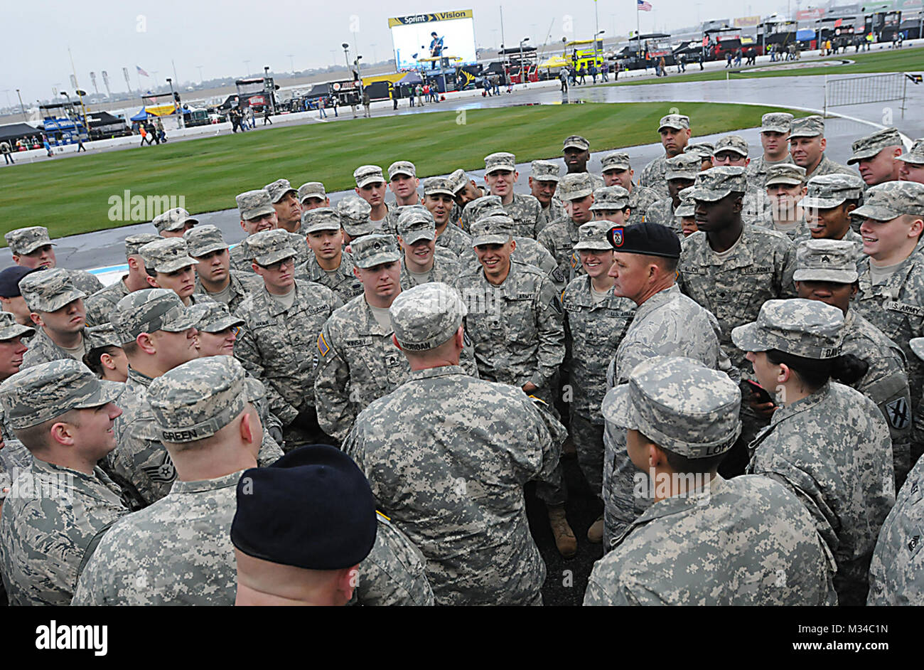 Hampton, Ga., March 1, 2015 — Sgt. 1st Class Dusty Morgan of the Georgia Army National Guard relays changes to the itinerary to the Soldiers and Airmen participating in the pre-race ceremonies at the QuikTrip Folds of Honor 500 at Atlanta Motor Speedway. NASCAR - QT 500 by Georgia National Guard Stock Photo