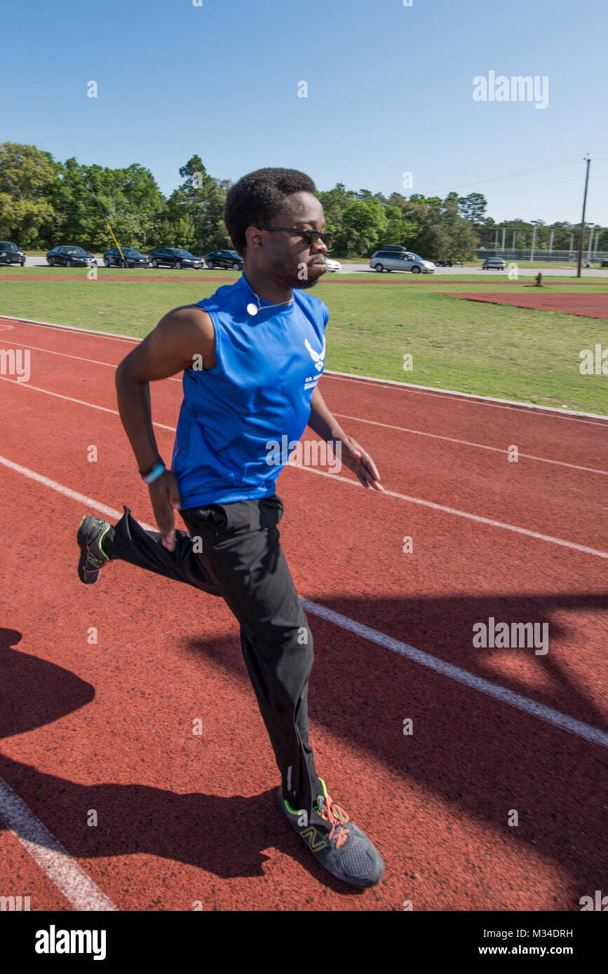 Senior Airman (Ret.) Ryan Cureton, an Air Force wounded warrior athlete, practices sprints during the Warrior Games Training Camp at Eglin Air Force Base, Fla., April 21, 2015. The training camps, hosted by the U.S. Air Force Wounded Warrior Program in coordination with Brig. Gen. David Harris, 96th Test Wing commander, assist in recovery and promote mental and physical health as well as teamwork. (U.S. Air Force photo/Maureen Stewart) 150421-F-AE839-343 by Air Force Wounded Warrior Stock Photo