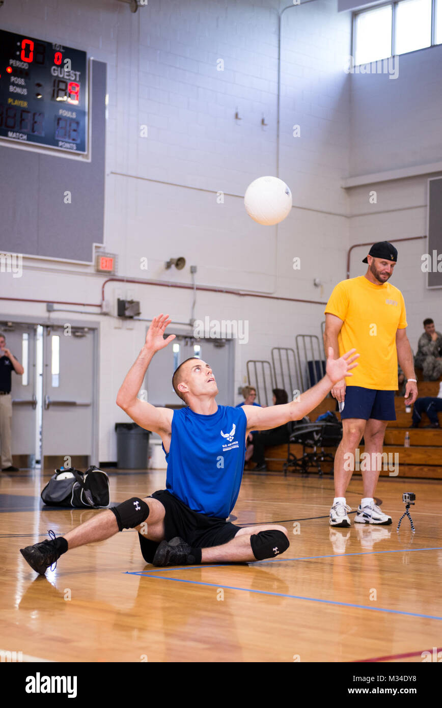 Tech. Sgt. Benjamin Koren, an Air Force wounded warrior athlete, serves the ball during a volleyball scrimmage at the Warrior Games Training Camp at Eglin Air Force Base, Fla., April 22, 2015. The training camps, hosted by the U.S. Air Force Wounded Warrior Program in coordination with Brig. Gen. David Harris, 96th Test Wing commander, assist in recovery and promote mental and physical health as well as teamwork. (U.S. Air Force photo/Maureen Stewart) 150422-F-AE839-343 by Air Force Wounded Warrior Stock Photo