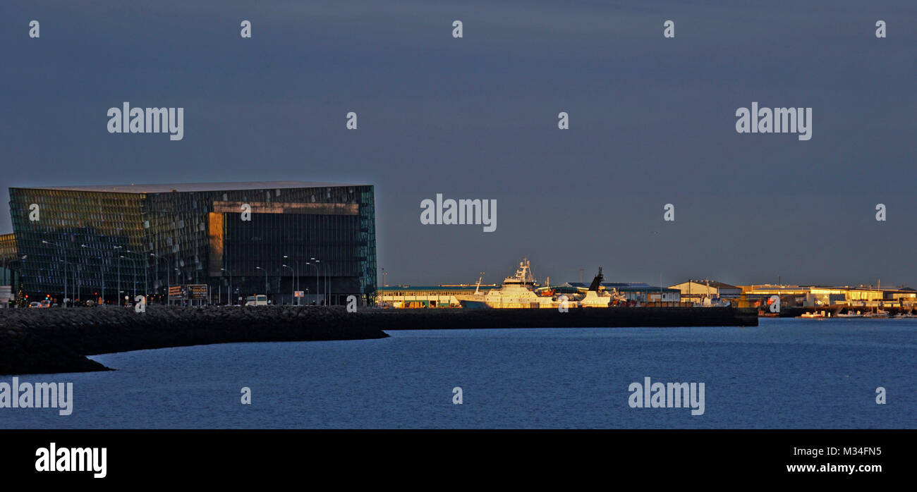 The winter sunset and sunrise in Iceland produces amazing sky lighting.  Views across the city of Reykjavic. Stock Photo