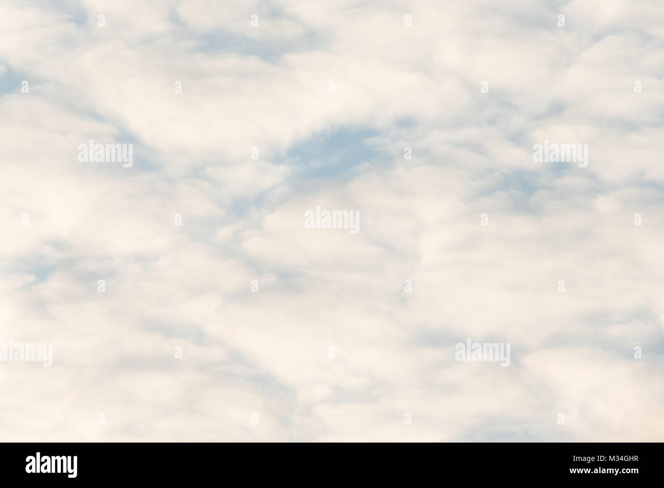 Calm sunset clouds and blue sky Stock Photo - Alamy