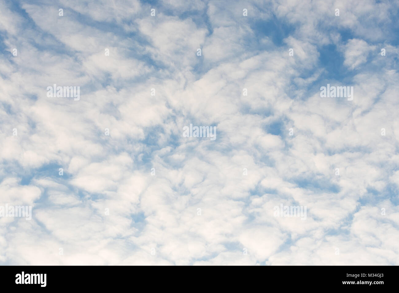 Calm sunset clouds and blue sky Stock Photo - Alamy