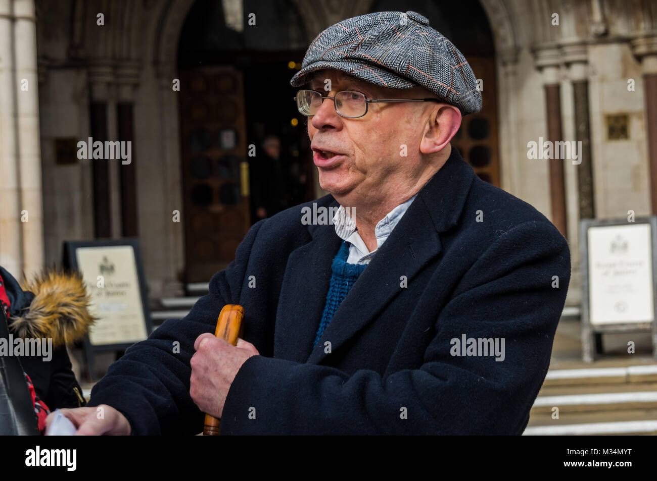 February 8, 2018 - London, UK. 8th February 2018. Ian Bone celebrates in the pub opposite the High Court after stopping an attempt by lawyers acting for the Qatari royal family to prevent a Class War protest against the ten empty Â£50million pound apartments in The Shard. They had tried to get an injunction against protests by Bone and ''persons unknown'' and to claim over Â£500 in legal costs from the 70 year-old south London pensioner, but had then offered to drop the case if Class War 'would stop attacking the Shard'. Their attempt to stifle protest was covered in national and international Stock Photo