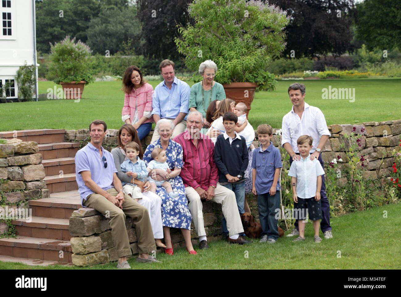 Grasten, Denmark. 1st Aug, 2011. The Danish royal family Prince Joachim (L), Princess Marie (2nd L) with Prince Henrik, (back, L-R) Carina Axelsson and partner Prince Gustav with Princess Benedikte and Crown Prince Frederik (R) with son Prince Christian, Queen Margrethe (4th L) with Prince Vincent, Prince Consort Henrik (C), Prince Nikolai (4th R) and Prince Felix (3rd R), Crown Princess Mary (hidden) with daughters Isabella and Josephine pose during the annual photo session at Graasten Palace in Grasten, Denmark, 1 August 2011. Credit: Albert Nieboer | usage worldwide/dpa/Alamy Live News Stock Photo